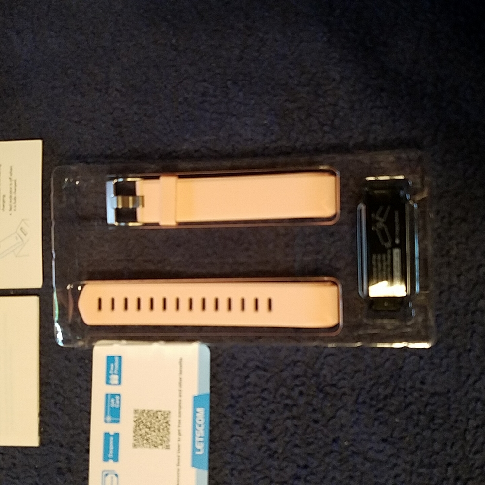 New in box fitness tracker! Pink. Monitors heart rate, sleep, calories, etc.